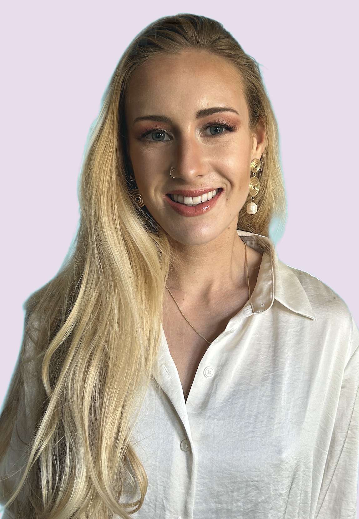 Sarah Cushing, Registered Psychotherapist, smiling in a white blouse